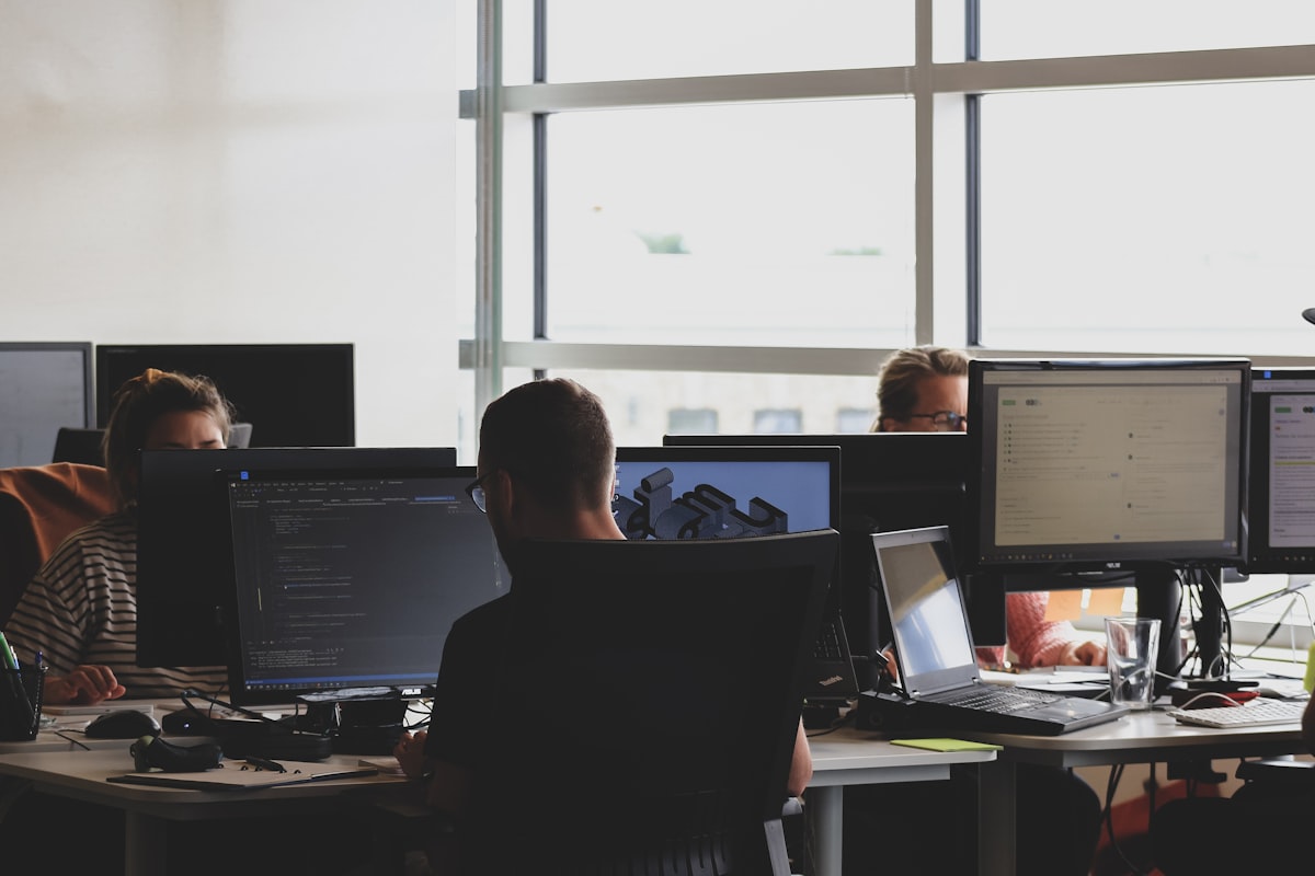 Stressed employee at desk experiencing burnout from repetitive data entry work